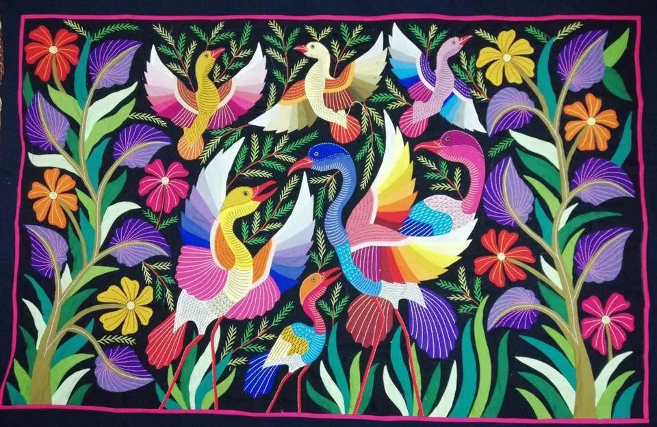 Khayamiya textile with stylised birds against a dark background