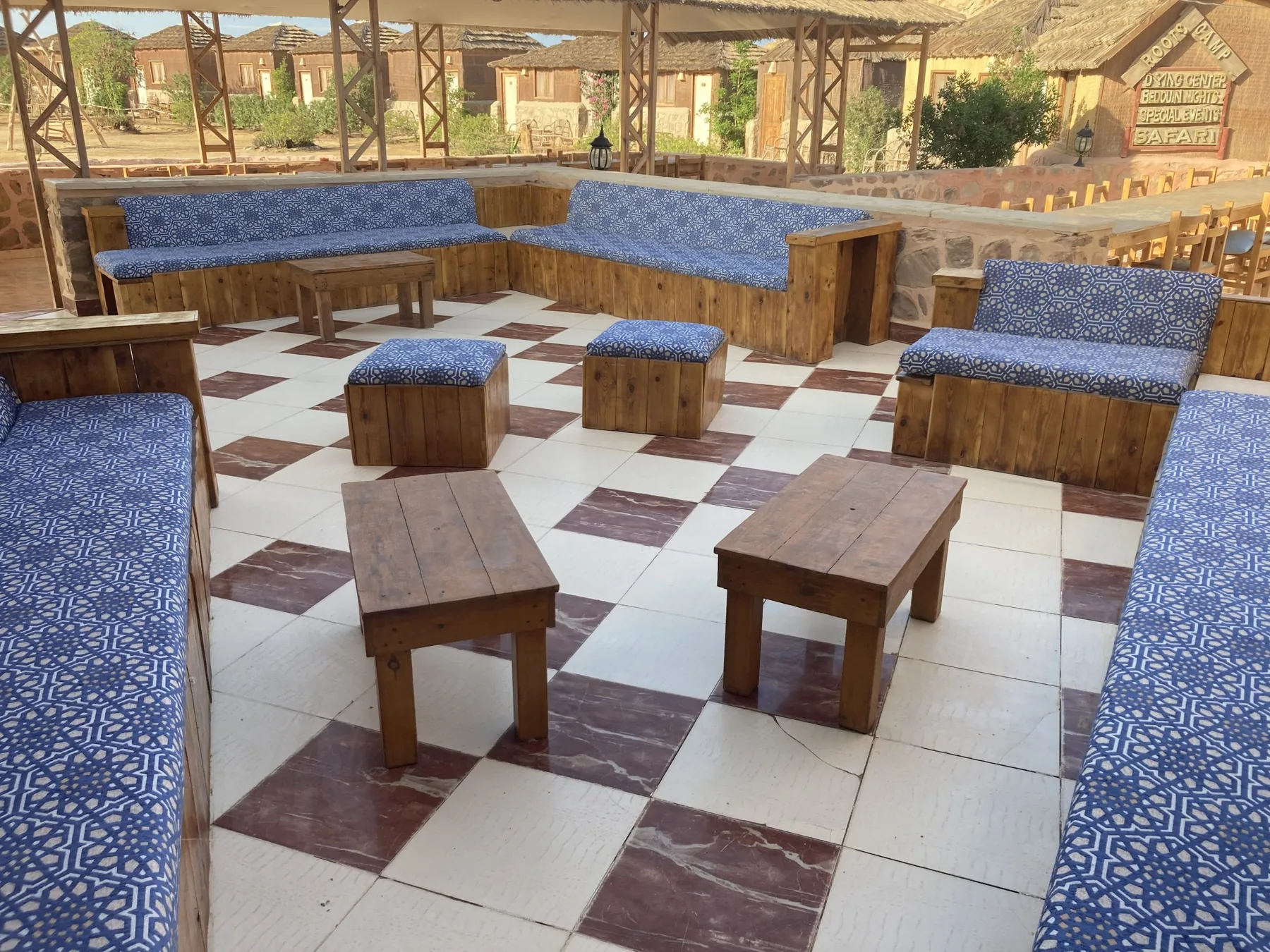 Shaded outdoor seating on the terrace at Roots Red Sea